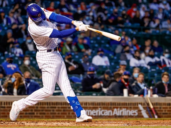 Apr 22, 2021; Chicago, Illinois, USA; Chicago Cubs third baseman Kris Bryant (17) hits a two-RBI double against the New York Mets during the third inning at Wrigley Field.